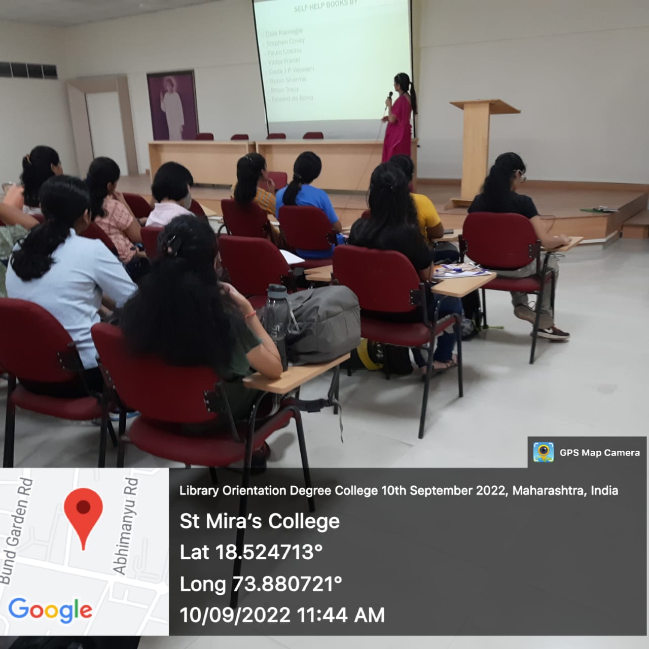 Librarian explaining self-selp book collection